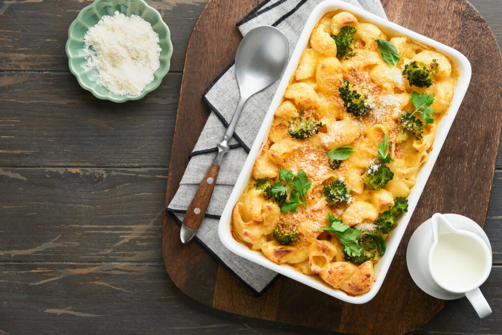 Golden baked macaroni and cheese in a casserole dish topped with crispy breadcrumbs.