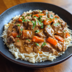 Homemade Hamburger Helper Beef Stroganoff served in a white bowl with parsley garnish.